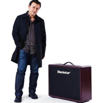 James Dean Bradfield beside an angled blackstar guitar amp
